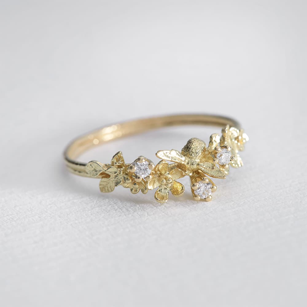beekeeper twist ring with three diamonds