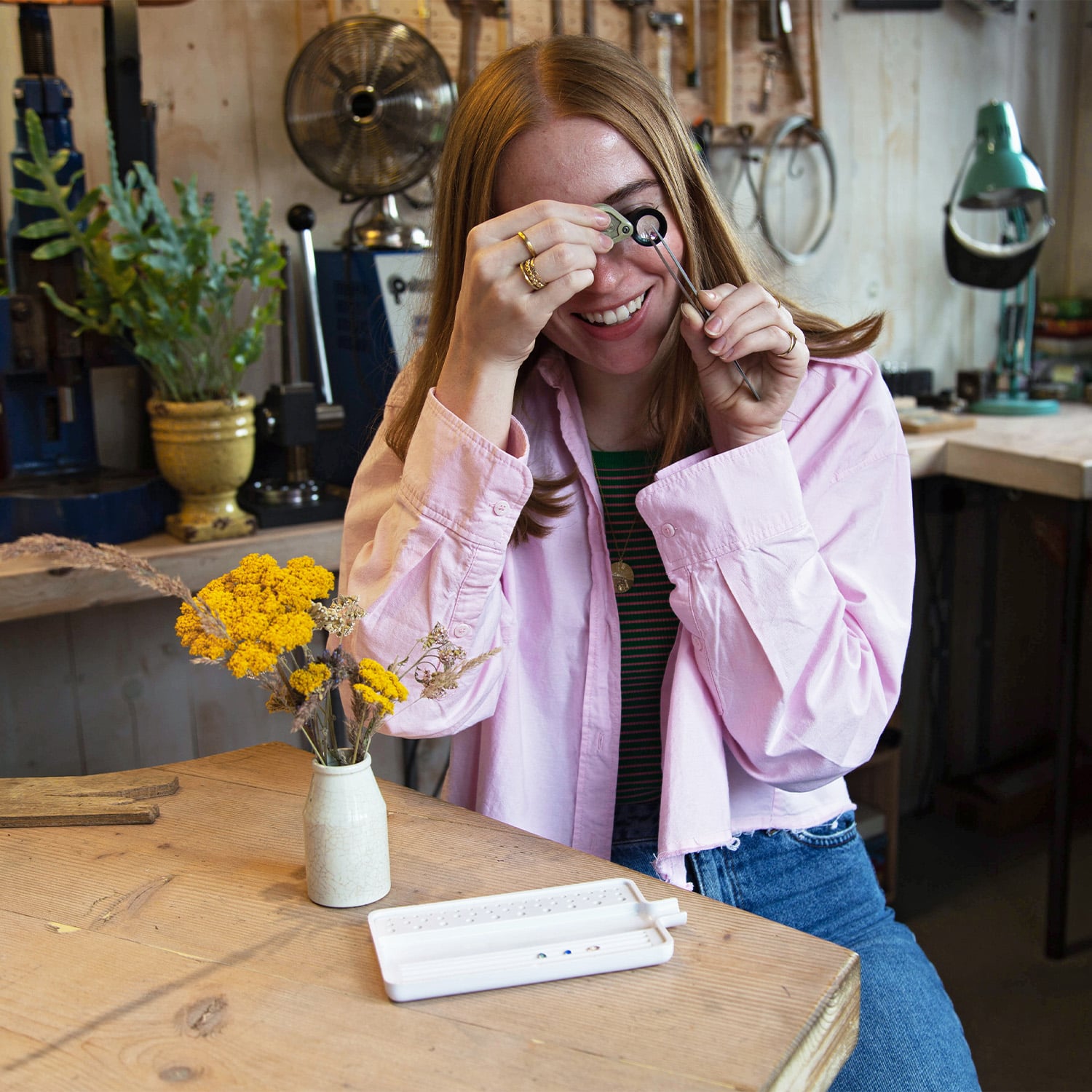 Bespoke Designer measuring a sapphire in the snowsfield workshop