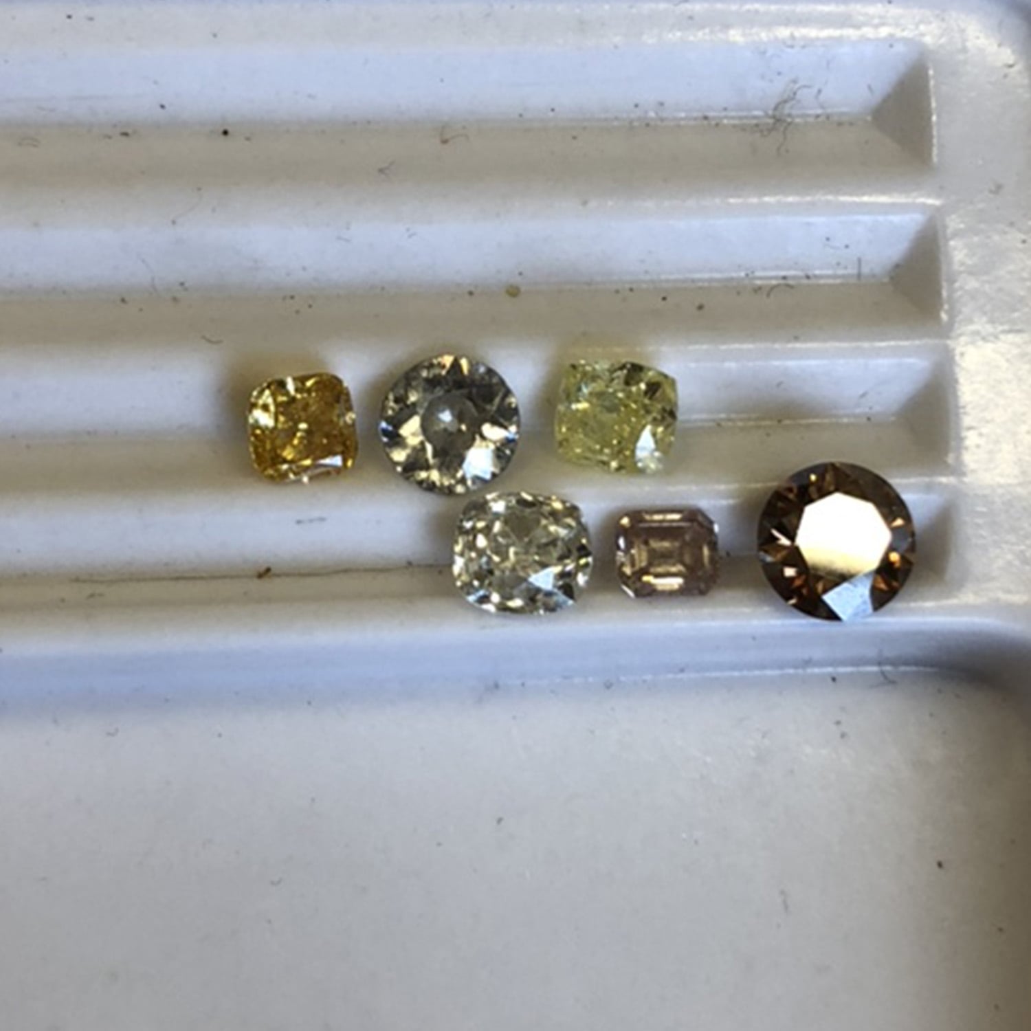 coloured diamonds in the workshop bespoke by alex monroe