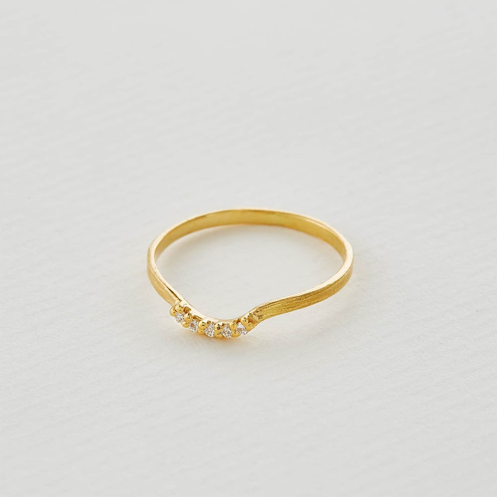 curved half halo diamond band in soild gold by alex monroe jewellery