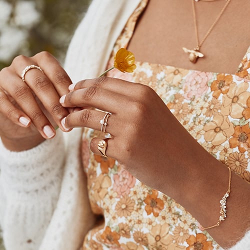 model shot of In-Line Garden Gathering Bracelet with Itsy Bitsy Bee by Alex Monroe Jewellery