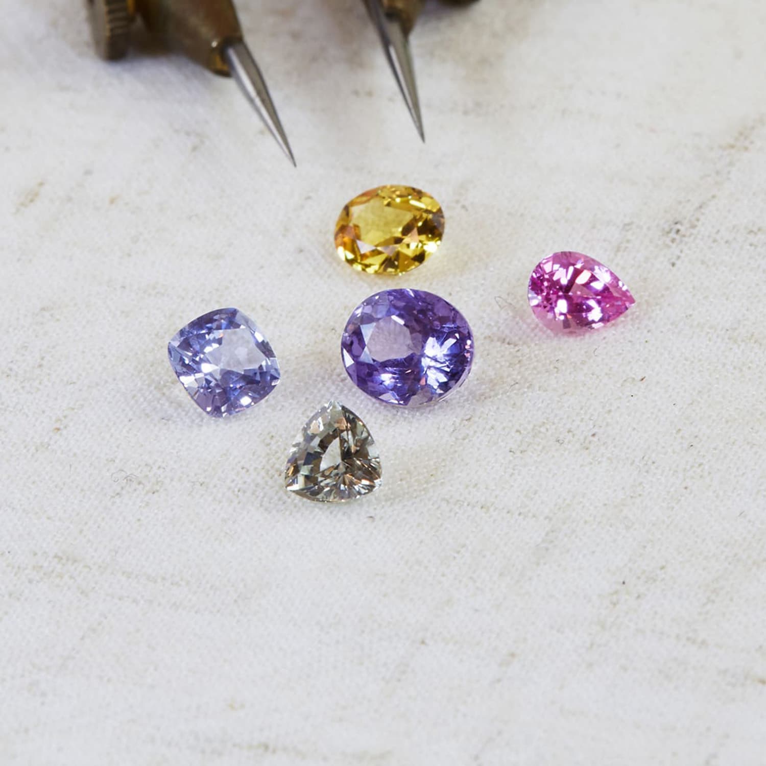 2 purple , 1 yellow, 1 pink and a grey sapphire by Alex Monroe Jewellery