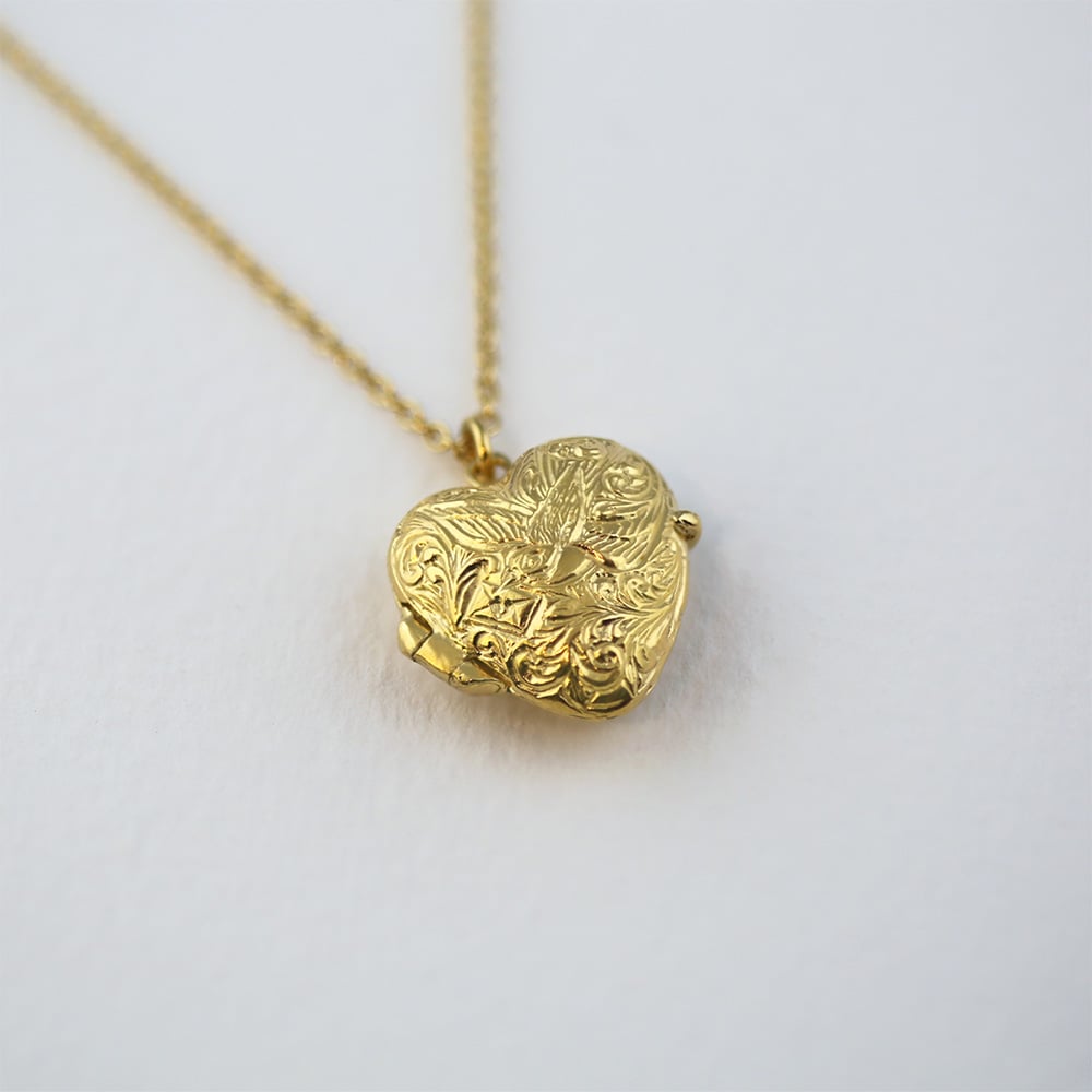 Paper shot of Alex Monroe Victoriana Keepsake Heart Locket.