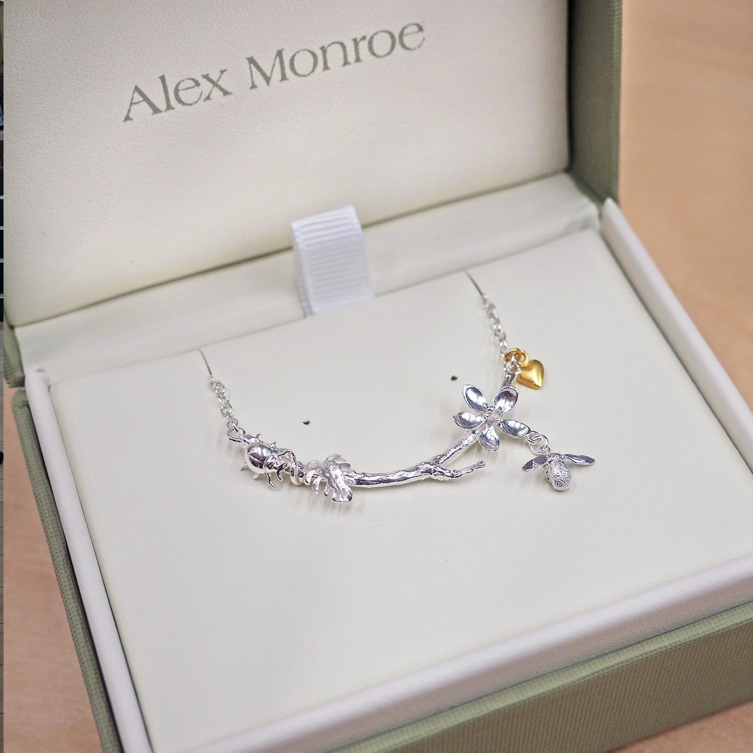 Handmade Alex Monroe sterling silver necklace with a gold plated heart