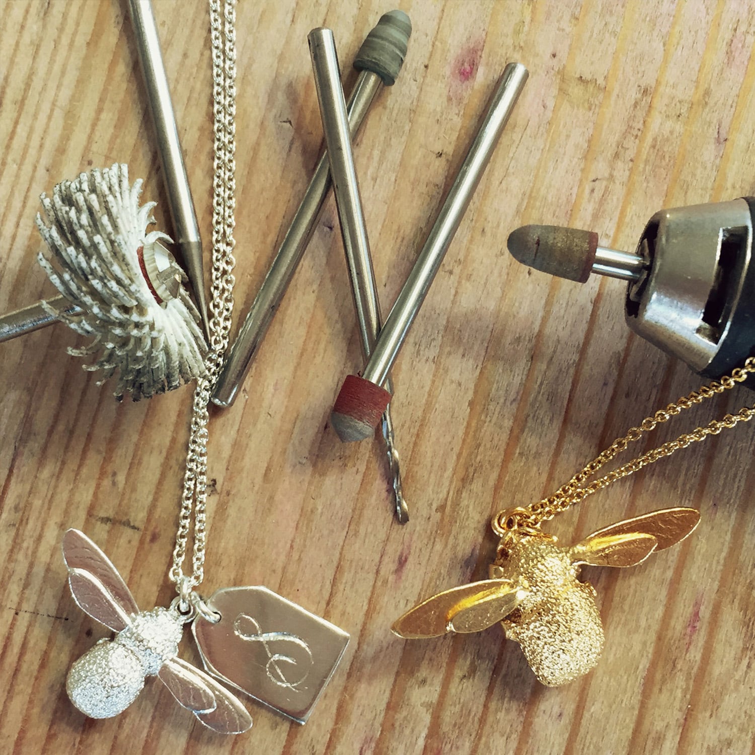 Workshop Tools Silver Baby Bee with a engraved tag and Gold Bumbleebee by Alex Monroe Jewellery