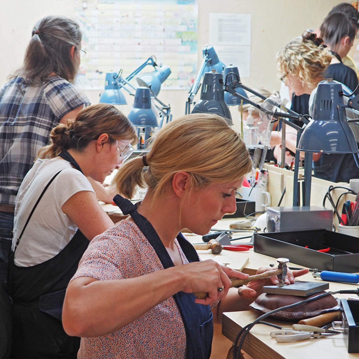 Student making a Bee Loop necklace at Alex Monroe's Jewellery School Class in his Tower Bridge Workshop